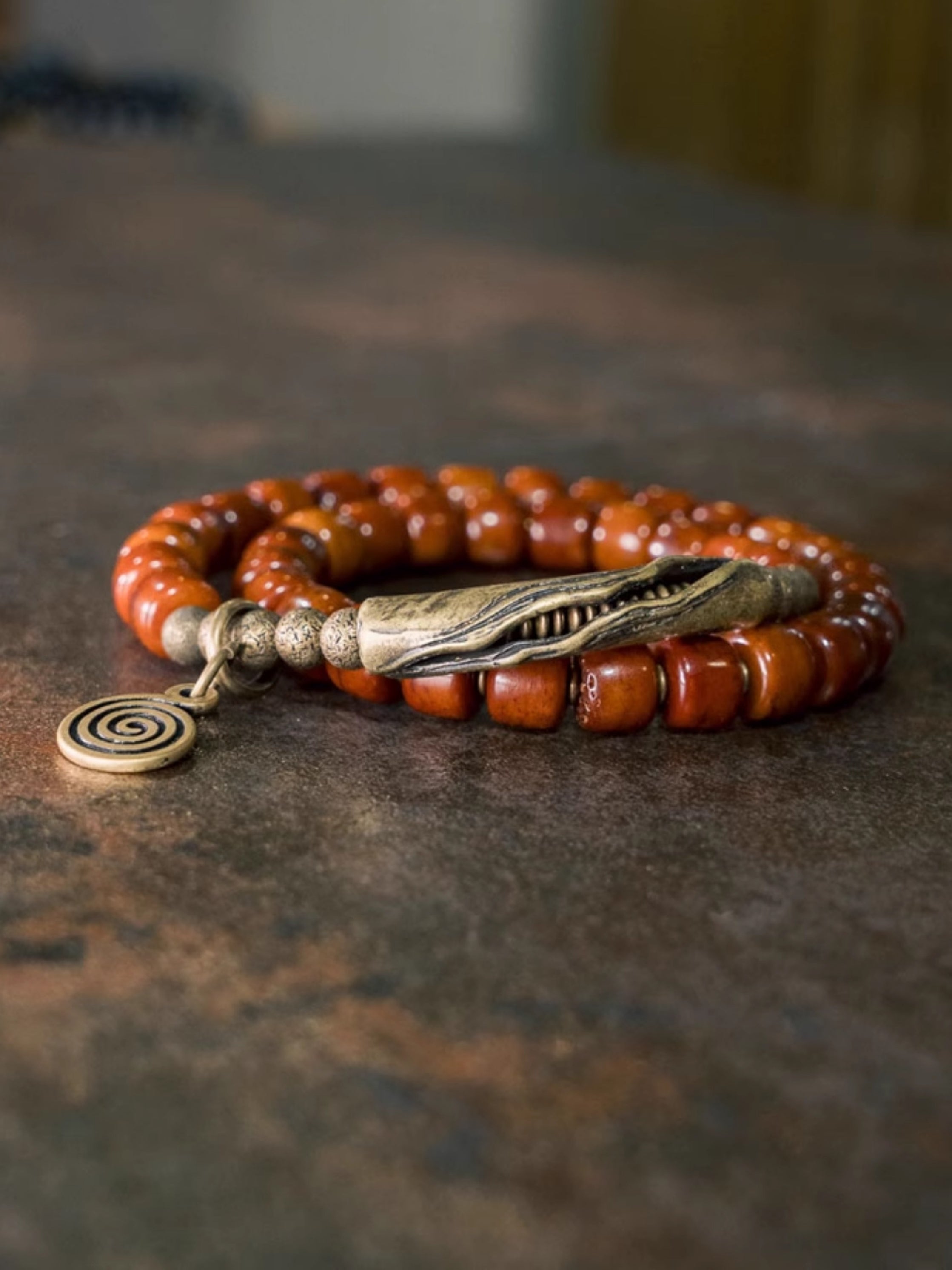 Flame Guardian Bracelet – Red Bone Beads with Vintage Brass Charm | Courage & Protection