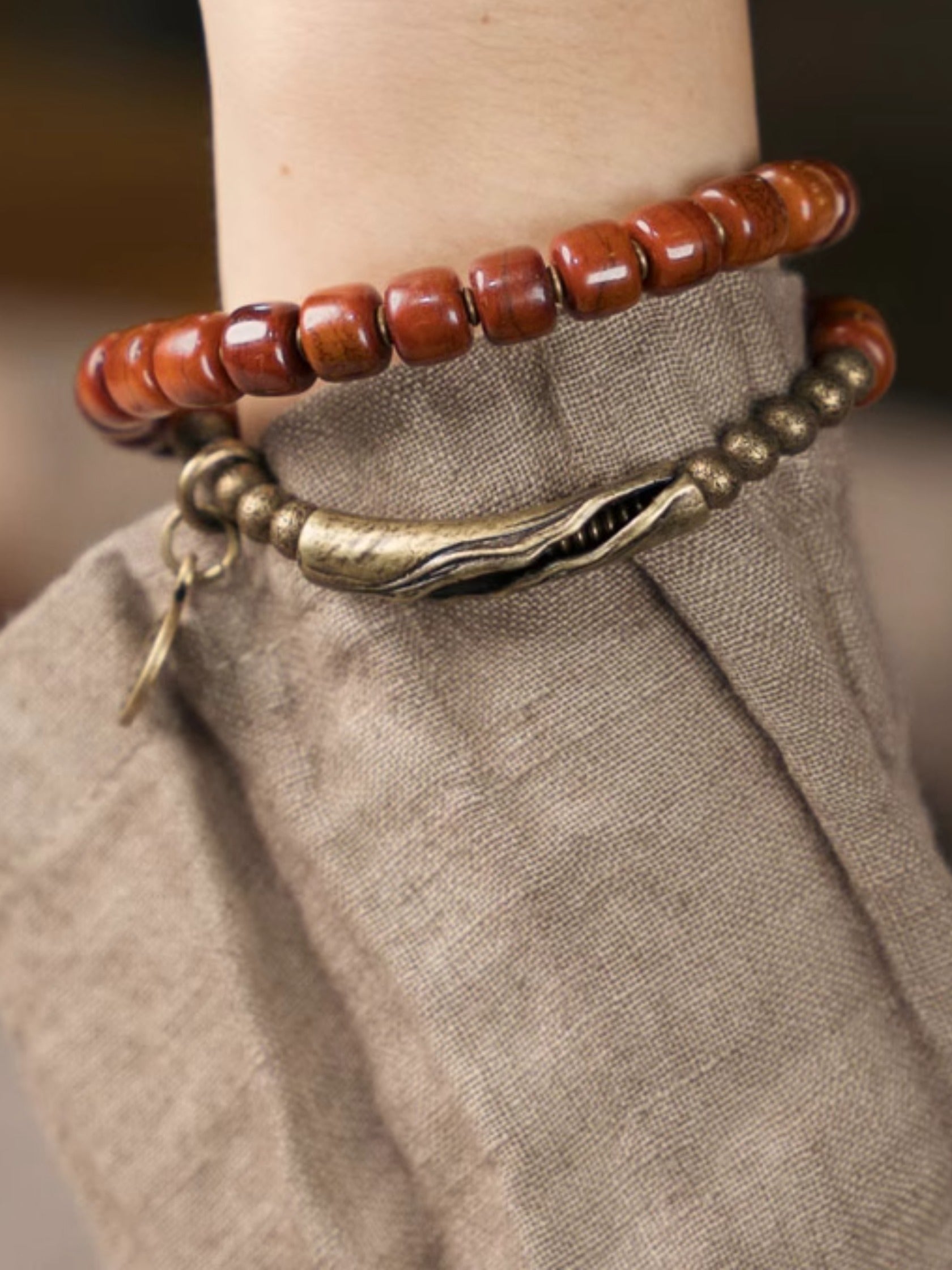 Flame Guardian Bracelet – Red Bone Beads with Vintage Brass Charm | Courage & Protection