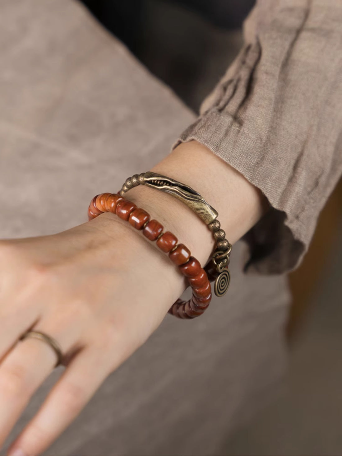 Flame Guardian Bracelet – Red Bone Beads with Vintage Brass Charm | Courage & Protection